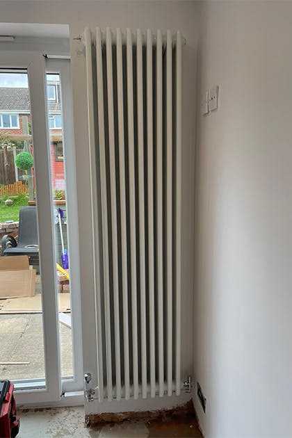 Column radiator installed in studley